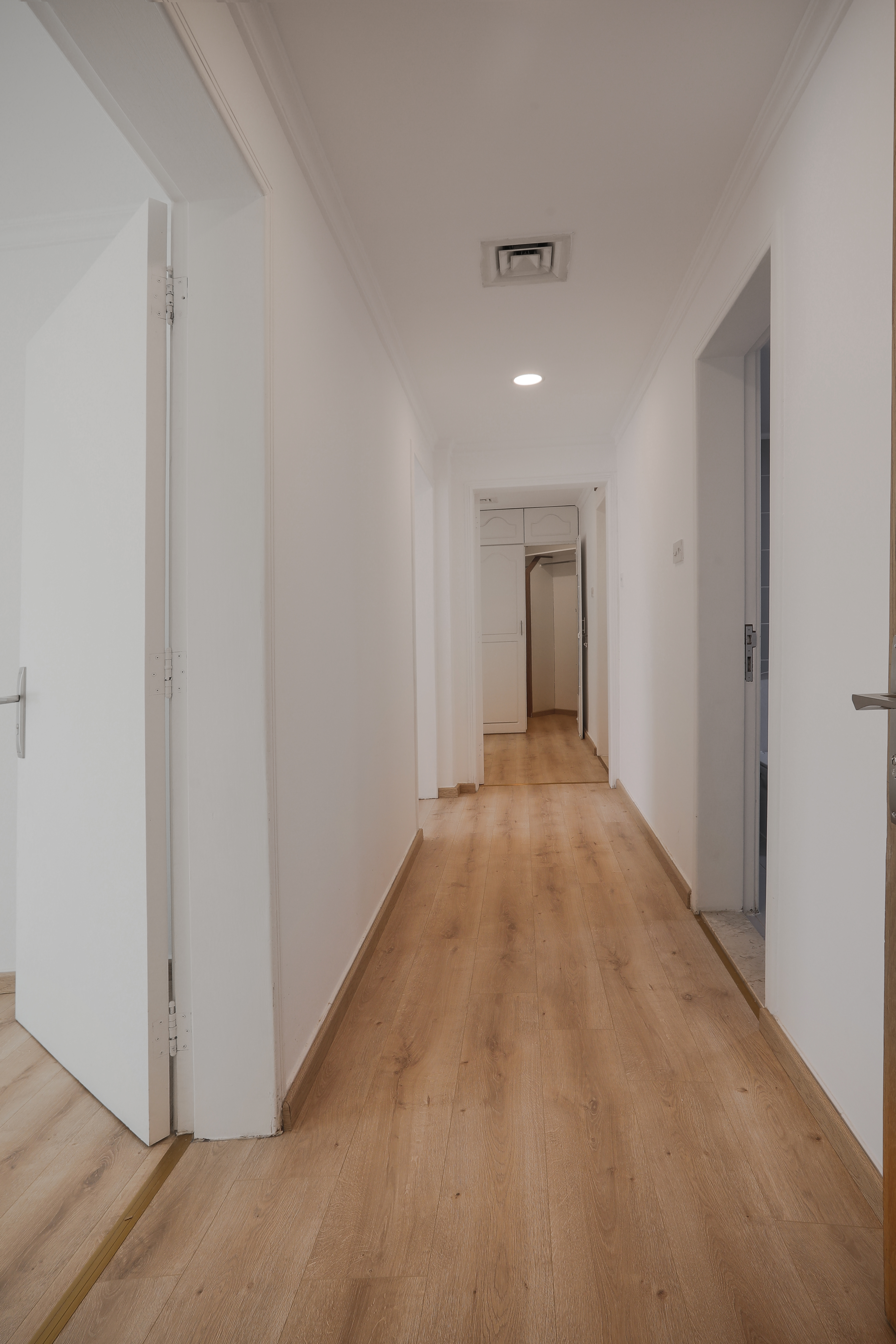 Spacious Corridor with Wooden Flooring